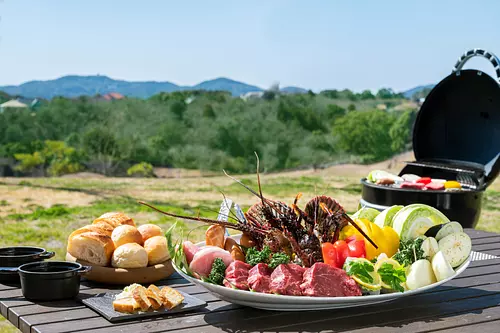Enjoy a barbecue at the Satoyama Lounge on top of a hill